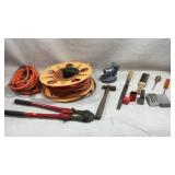 Assortment of tools including extension cords,