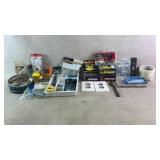 Assortment of screws, hangers, staples, and more