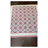 Vtg handcrafted quilt featuring a repeating block