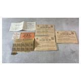 Assortment of wwII ration stamps, books, and