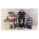 Three Vintage Robot Figurines with Features