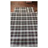 black, red, and white tartan plaid woven fabric