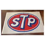 large fabric STP banner featuring the iconic