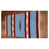 light blue and red striped hand-woven textile
