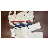 assortment of white martial arts uniforms (