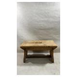 Vintage rustic wooden footstool featuring a