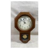 vintage Elgin quartz wall clock featuring a