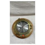 vintage nautical porthole wall clock featuring a