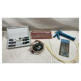 mix of assorted hand tools, hardware, and
