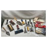 assortment of used masonry and drywall finishing