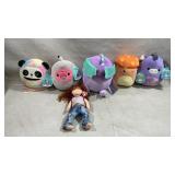 assortment of plush toys, including several