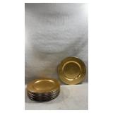round metallic gold charger plate with a smooth,