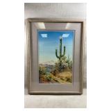 framed artwork is a signed desert watercolor