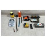 collection of firearm maintenance supplies,
