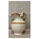 vintage cream-colored ceramic or porcelain pitcher