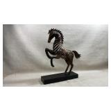 rearing metal horse sculpture crafted from
