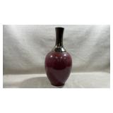 Pier 1 Imports ceramic vase has a rich oxblood