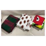 Three throw blankets including m&m, football and