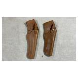2 leather pistol holsters