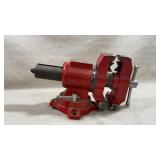 Roughneck 5' red multi-purpose bench vise with a