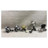 collection of five vintage fishing reels
