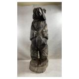 tall, hand-carved wooden standing bear sculpture