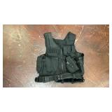 black cross-draw tactical utility vest featuring