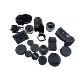 Assortment of camera equipment lenses and more