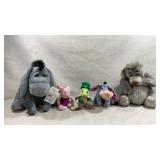 collection of Disney character plush toys,