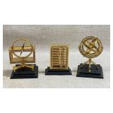 three miniature brass and black wooden desktop