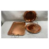 set of polished copper serving trays and