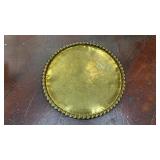 large, round vintage brass tray/wall art  with a