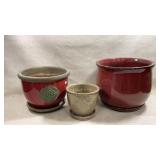 set of three glazed ceramic plant pots with