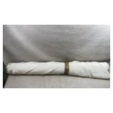 Large roll of plain white fabric