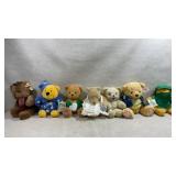 Collection of plush Pooh bears and others from