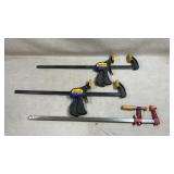 Group of woodworking clamps, including two IRWIN