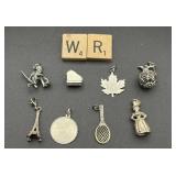 SELECTION OF STERLING SILVERY CHARMS/PENDANTS