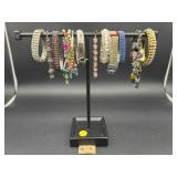 SELECTION OF FASHION BRACLETS WITH METAL HOLDER
