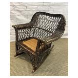 ANTIQUE WICKER ROCKER WITH CANE BOTTOM