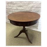 THREE LEGGED ROUND TABLE