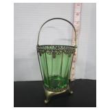 GREEN GLASS IN ORNATE METAL HOLDER