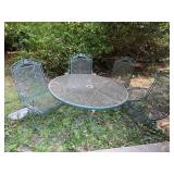 IRON OUTDOOR TABLE WITH 4 ROCKING CHAIRS