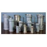 11 PEWTER MEASURING JUGS