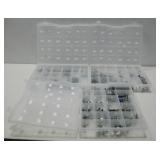 Three Organizers Of Trinkets On Glass Pebbles