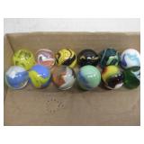 Twelve Assorted Shooter Marbles