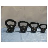 Four Exercising Kettle Bells 5 Lbs - 20 Lbs
