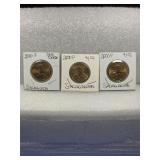 Three  2000-P Sacagawea Dollar Coins