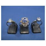 Two Sterling Silver Rings W/Goldtone Ring