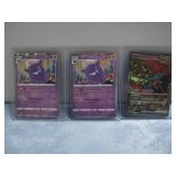 Three Japanese Pokemon Cards In Protectors