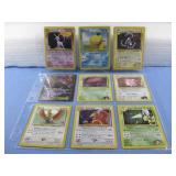 Nine Assorted Pokemon Trading Cards In Sleeve